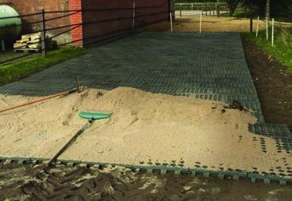 Grids being filled and topped with sharp sand