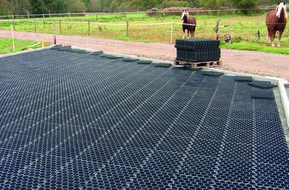 Slabs laid across an arena before the tread layer goes down